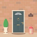 Cute front dark door with copper fittings. Entrance to house with lanterns