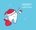 Cute funny cartoon tooth in a Santa Claus hat in red mittens with a bag of gifts and a bell. Royalty Free Stock Photo