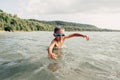 Cute funny Caucasian boy swimming in lake river with underwater goggles. Child diving in water Royalty Free Stock Photo