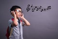 Cute funny children in dance studio, Cute little boy in headphones listening to music on color background