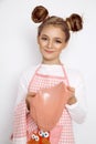 Cute funny girl with slime in the kitchen. The girl cooks and bakes her muffins, makes a cake and slime. Royalty Free Stock Photo