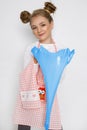 Cute funny girl with slime in the kitchen. The girl cooks and bakes her muffins, makes a cake and slime. Royalty Free Stock Photo