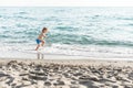 Cute funny little boy playing and having fun at sea shore. Summer beach vacation, childhood lifestyle , holiday travel Royalty Free Stock Photo