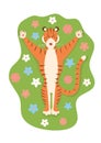 A cute funny striped tiger enjoys the spring, lies with his arms outstretched in a meadow with flowers.