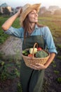 Cute Gardener Girl Posing on Vegetable Garden