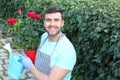 Cute gardener working with roses