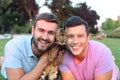 Cute gay couple with a bengal cat