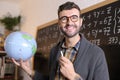 Cute geographer showing the world Royalty Free Stock Photo
