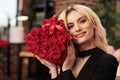 Cute gifriend posing with valentines day red roses bouquet Royalty Free Stock Photo
