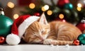 Cute ginger kitten in red Santa hat sleeping among Christmas decor with garland lights bokeh festive background. Royalty Free Stock Photo