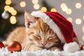 Cute ginger kitten in red Santa hat sleeping among Christmas decor with garland lights bokeh festive background. Royalty Free Stock Photo