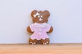 Cute gingerbread bear decoratd with white and pink icing