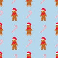 Cute gingerbread and candy cane vector seamless pattern. Christmas gingerbread man cookies and sweet sugar candy canes Royalty Free Stock Photo