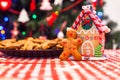 Cute gingerbread man in front of his candy ginger Royalty Free Stock Photo