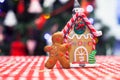 Cute gingerbread man in front of his candy ginger Royalty Free Stock Photo
