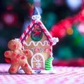 Cute gingerbread man in front of his candy ginger Royalty Free Stock Photo