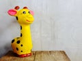 giraffe statue ceramic with space copy on wooden background