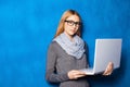 Cute girl against blue wall Royalty Free Stock Photo