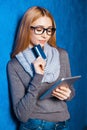 Cute girl against blue wall Royalty Free Stock Photo