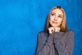 Cute girl against blue wall Royalty Free Stock Photo