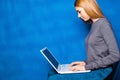 Cute girl against blue wall Royalty Free Stock Photo