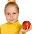 Cute girl with an apple in his hand Royalty Free Stock Photo