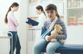 Cute girl with arm brace in the doctor`s office