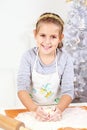 Cute girl baking cookies