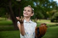 Cute girl with baseball in park