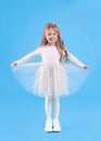 Cute girl in beautiful dress with diadem on light blue background. Little princess Royalty Free Stock Photo