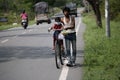 Cute girl on bicycle wearing face mask