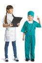 Cute girl and boy doctor in uniform standing Royalty Free Stock Photo