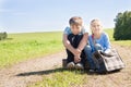 Cute girl and boy with suitcase