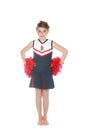 Cute girl in cheerleader outfit and pompoms Royalty Free Stock Photo