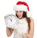 Cute girl in Christmas red santa hat with clock Royalty Free Stock Photo