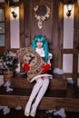 Cute girl cosplaying Christmas Miku santa dress