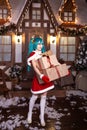Cute girl cosplaying Christmas Miku santa dress