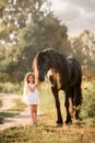 Cute girl in country style with her horse Royalty Free Stock Photo