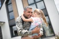 Cute girl crying after seeing her father returning home Royalty Free Stock Photo