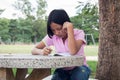 Cute girl doing homework in the park Royalty Free Stock Photo