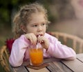 Cute girl drinking juice Royalty Free Stock Photo