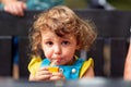 Cute girl drinking juice in park Royalty Free Stock Photo