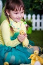 Cute girl with duckling Royalty Free Stock Photo