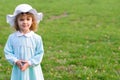 Cute Girl in Easter Dress and Bonnet