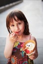 Cute girl eating ice-cream outside Royalty Free Stock Photo