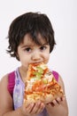 Cute girl eating pizza