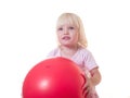 Cute girl embraces red ball Royalty Free Stock Photo
