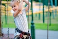 Teenage girl goes on hinged trail in rope park. Royalty Free Stock Photo