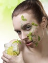 Cute girl with fresh make-up drinking cocktail Royalty Free Stock Photo