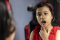 a cute girl in front of mirror Royalty Free Stock Photo